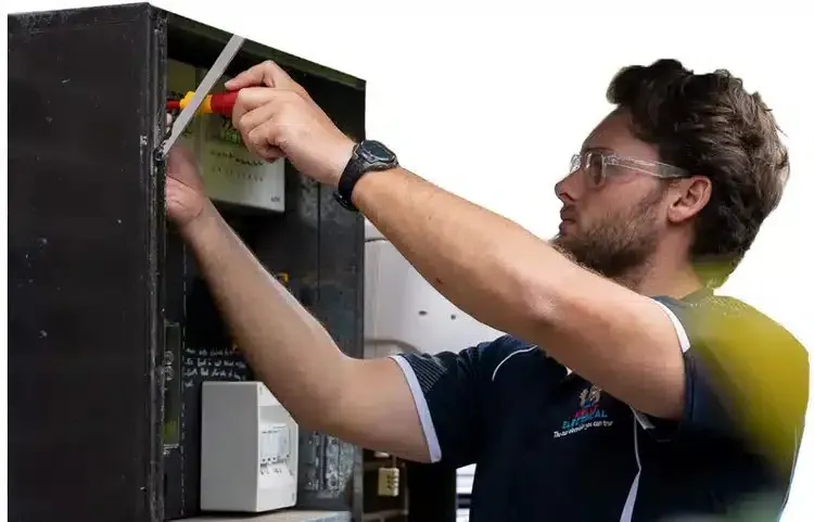 Jason Rowe from Restore Electrical working at a meter box
